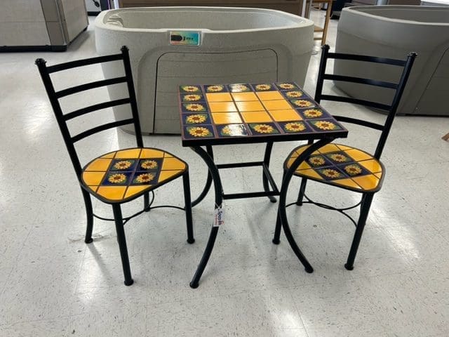 patio furniture in a showroom - 2 patio chairs and patio table
