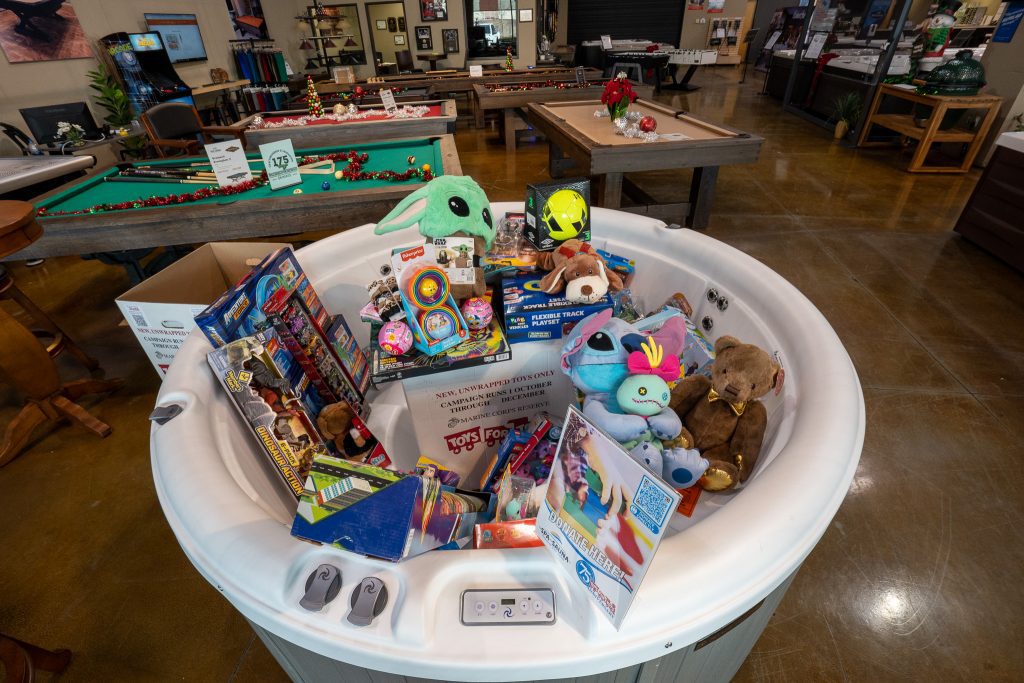 Hot Tub full of toys for Toys for Tots at The Spa and Sauna Co. in Reno