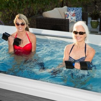 Two women exercising in a swim spa
