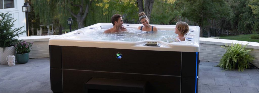 A family in a Highlife Collection Hot Tub