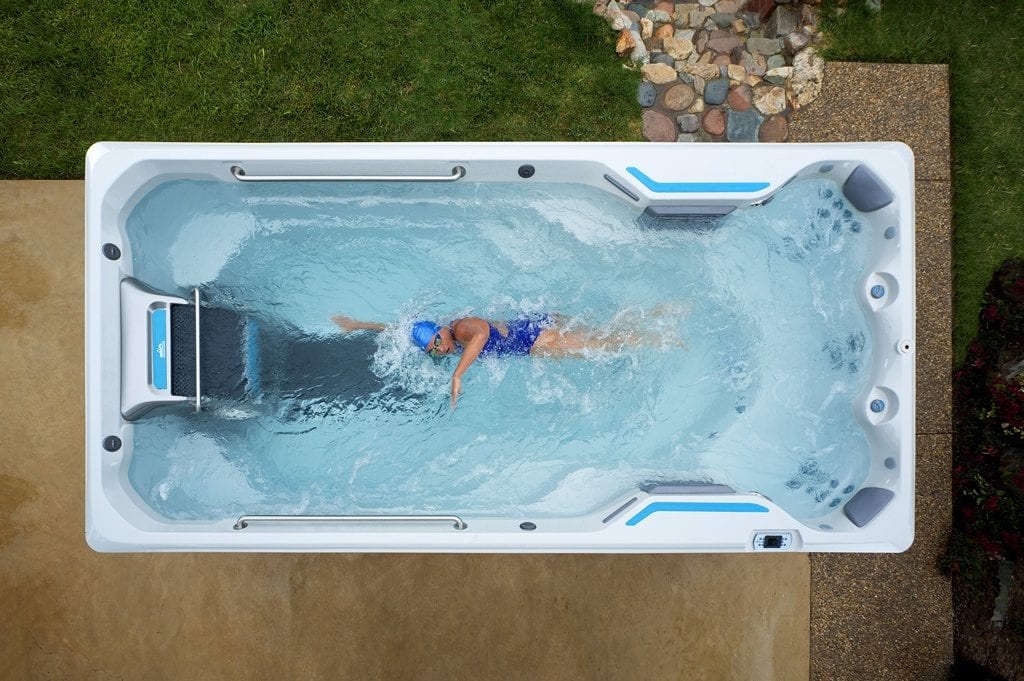 A swimmer in an Endless Pool Swim Spa